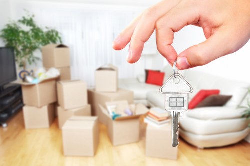 Organized storage space with boxes and furniture in Crayford
