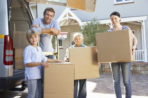 Furniture being carried through a residential building in Crayford