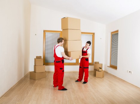Professional movers handling furniture during local removals in Crayford